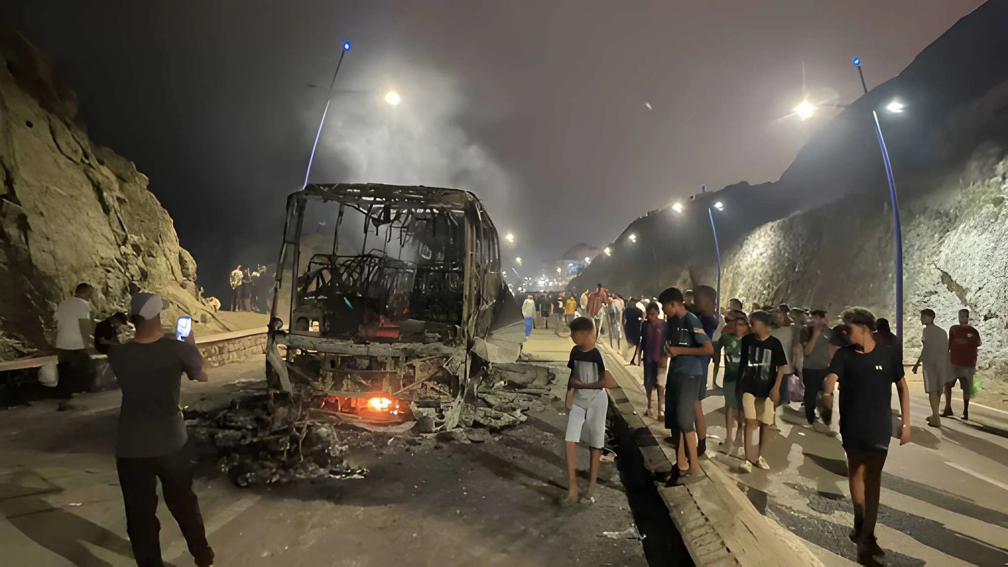 Sleepless night near Spain's Ceuta border as migrants torch vehicles