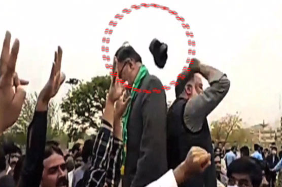 shoe-hurled-at-pml-n-s-ahsan-iqbal-outside-parliament-house